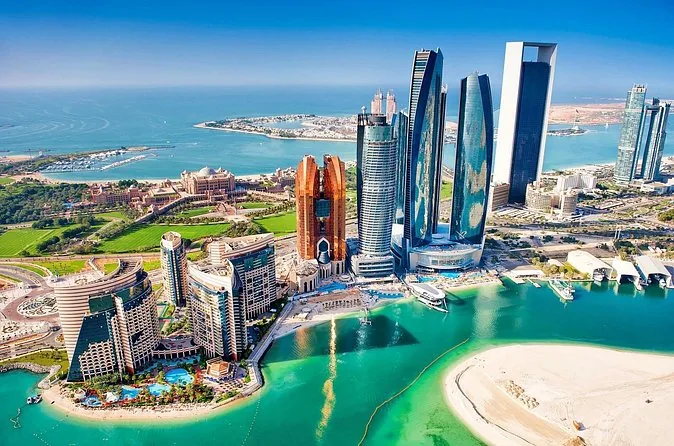 Aerial view of the Etihad Towers, Emirates Palace and the Abu Dhabi coastline